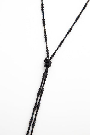 Long collier noir à nœud